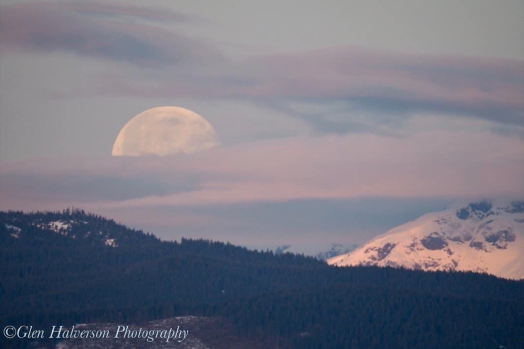 The full moon sets over the Comox Glacier.