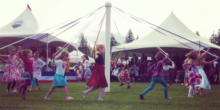 Kids dance around a Maypole in Cumberland in 2015.