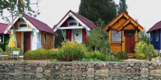 Tiny homes sit next to one another in a tiny home community.
