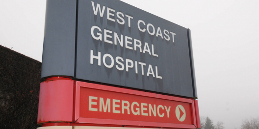 A photo of the West Coast General emergency department entrance sign on a moody day.