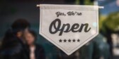 Shallow focus photo of white open sign