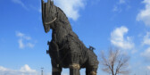 A picture of the Trojan Horse from the movie Troy. The horse is a large sculpture made of wood.