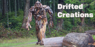 A sasquatch made of driftwood walks toward the camera out of the woods.