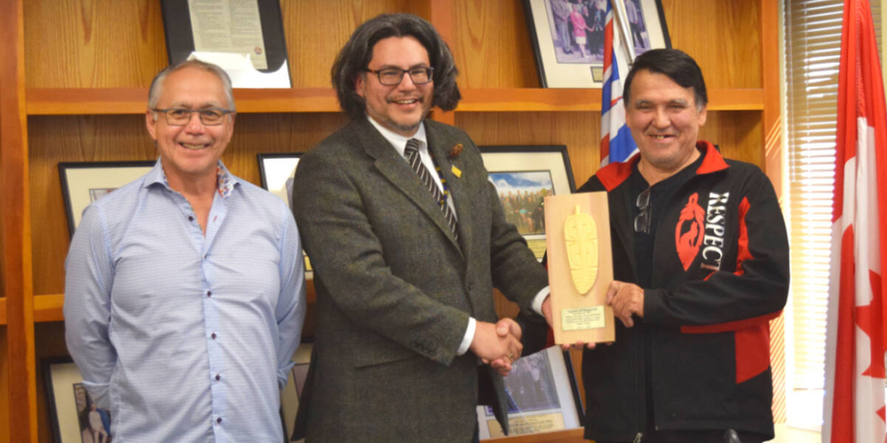ACRD Chair John Jack presents Alan and Chuck McCarthy of the Ucluelet First Nation with a plaque of recognition.
