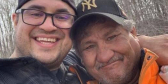 Métis hunters, Jacob Sansom and Maurice Cardinal, smile for a selfie.