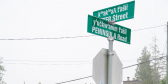 Street signs for the intersection of Otter St. and Peninsula Rd.