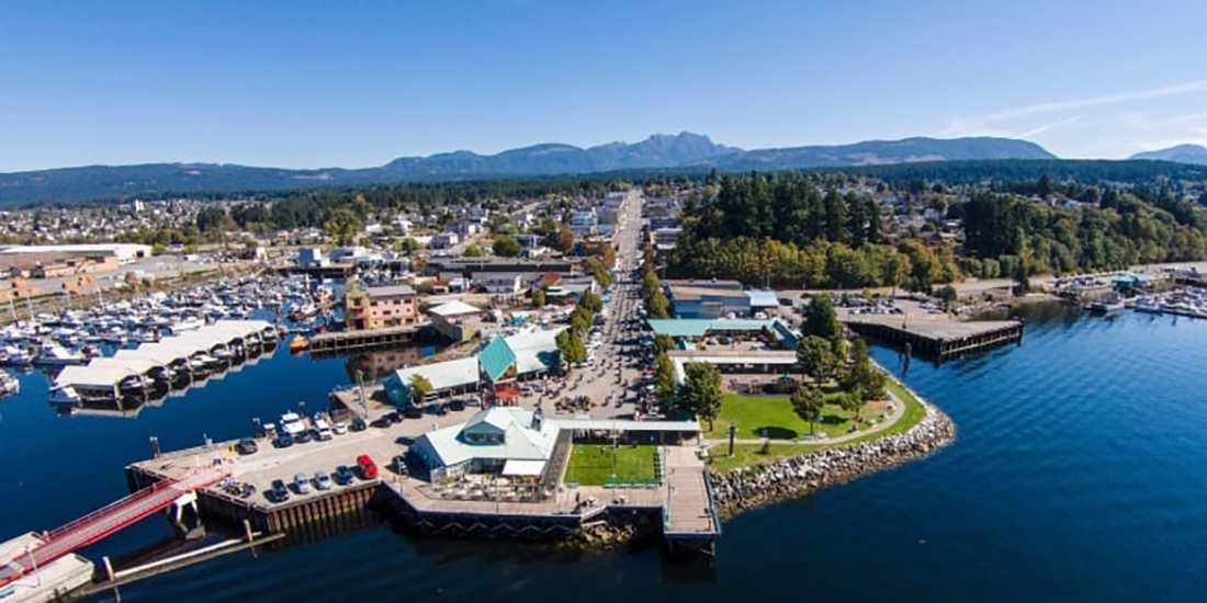 An aerial photograph of the Somass Lands in Port Alberni on a cloudless summer day.