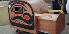 A close-up of the tiny home pod prototype with the sea trout design on the side.