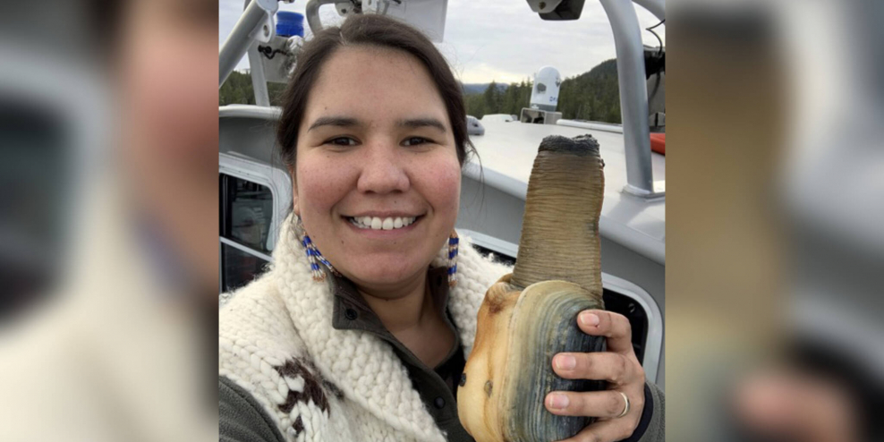 MaPP Implementation Coordinator Desiree Lawson holds up a large geoduck. She is smiling, because wouldn't you if you were holding a huge geoduck?